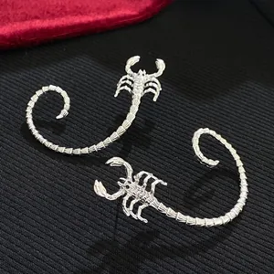 Detailed view of silver scorpion hand jewelry with intricate 3D jointed tail design.
