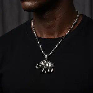 Detailed close-up of a vintage titanium steel elephant pendant necklace on a model