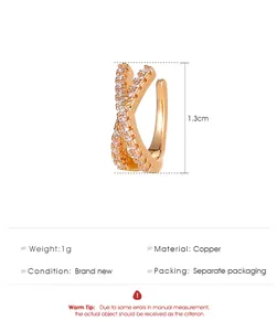Detail showing 1.3cm size of the X-shaped zircon-inlaid gold ear cuff.