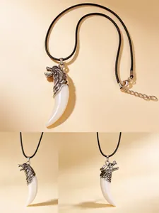 Detailed close-up view of a men's wolf tooth resin pendant necklace with black leather cord.
