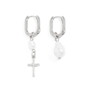 Asymmetric silver U-shape hoop earrings with white pearl and cross charm detail