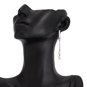 Silver U-shaped hoop earring with pearl tassel chain on black mannequin