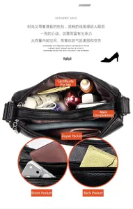 Détail d'un sac à main en cuir noir montrant les poches et la capacité.