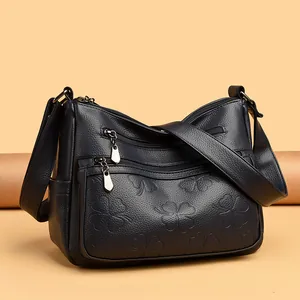 Sac bandoulière en cuir texturé pour femmes avec motif floral embossé bleu foncé