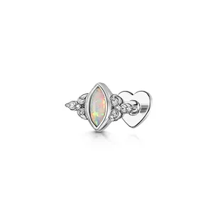 Detailed view of the marquise-shaped opal and heart flat back on the silver cartilage stud