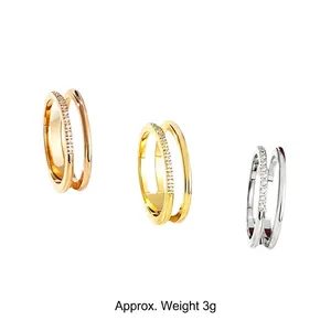 Detail of double-layer titanium steel rings with crystals in three plating colors.