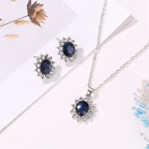Elegant royal blue crystal necklace and earring set with sunburst design