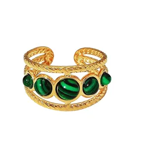 Anello vintage in acciaio inossidabile dorato con bordi intrecciati e pietre di malachite