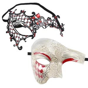Detailed view of black metal filigree mask and silver phantom half mask for masquerade
