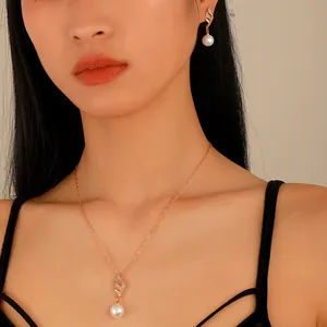 Elegant pearl and zirconia jewelry set including drop necklace and earrings for women