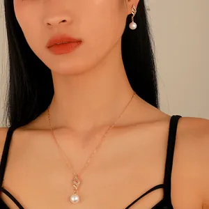 Elegant rose gold pearl and zircon jewelry set featuring wave-shaped necklace and earrings