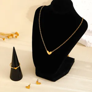Elegant gold-toned heart-shaped jewelry set with necklace, ring and stud earrings.