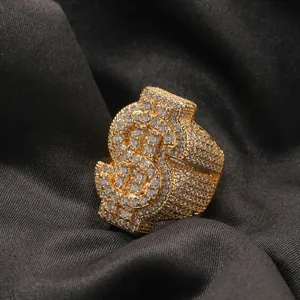 Detailed close-up of hip hop dollar sign ring with full iced out diamond stones.