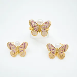 Detailed view of Monet garden butterfly ring and earring set with freshwater pearls.