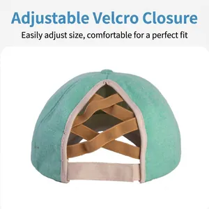 Close-up of the adjustable Velcro strap and crisscross ponytail design on knit cap