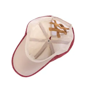 Inside detail of knit ponytail baseball cap showing soft lining and cross bands