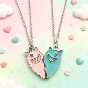 Close-up view of cute cartoon alpaca BFF magnetic heart necklaces for girls alloy