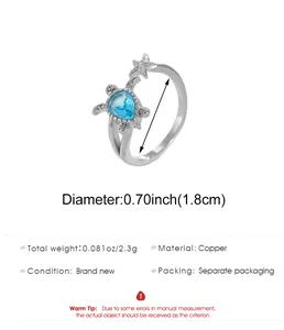 Anello tartaruga argento con gemma blu e stella marina, con specifiche di misura e peso.