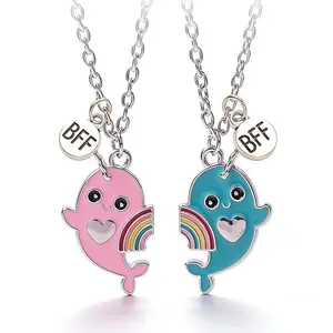 Pair of cartoon whale magnetic necklaces with heart and rainbow details for best friends