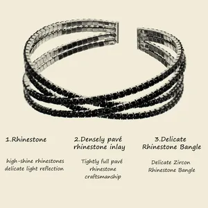 Detail view of a luxury criss-cross open bangle featuring black pavé rhinestone inlay
