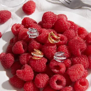 Luxury 18k gold plated stainless steel multi-band pavé crystal ear cuffs on raspberries