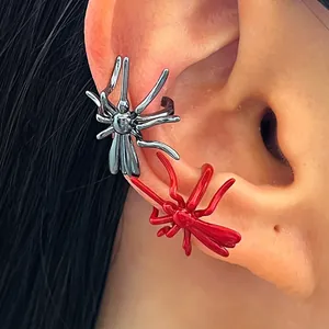 Detailed view of gothic spider ear cuffs in red and black metallic finishes for Halloween