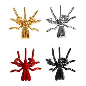 Minimalist Halloween spider-shaped ear cuffs set in gold, silver, red, and black finish.