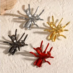 Close-up showing colorful gothic spider ear clips in silver, gold, black and red finishes