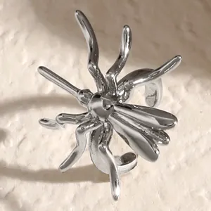 Detailed macro view of a silver-toned gothic spider ear cuff for Halloween