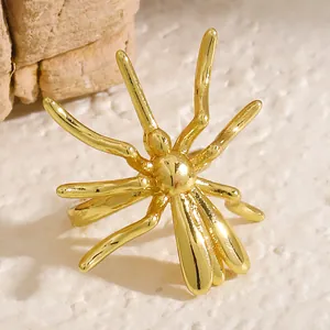 Detailed macro view of a unique gold-colored spider-shaped ear cuff for Halloween jewelry