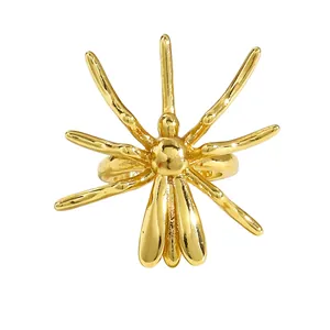Detailed macro view of a gold-tone spider-shaped non-pierced ear cuff jewelry