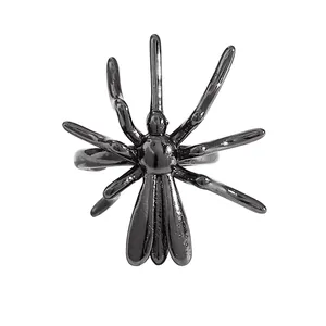 Macro view of a shiny black metallic spider ear cuff for Halloween gothic styling