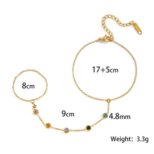 Bracciale con anello in acciaio inossidabile dorato con pietre preziose e misure.