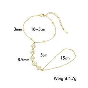 Bracciale da dito in acciaio inossidabile dorato con quadrifogli e misure dettagliate.