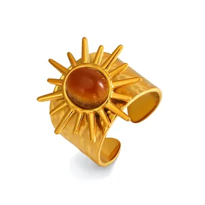 Vintage Edelstahl Breitbandring mit goldenem Sonnendesign und braunem Tigerauge-Stein