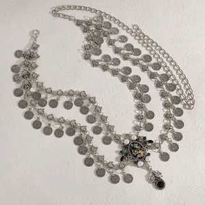 Detail of bohemian silver coin waist chain with colorful abalone shell and pearl pendant