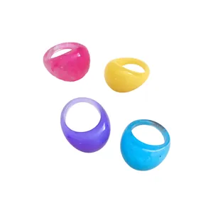 Set of four vibrant colorful marble resin rings with smooth geometric dome design