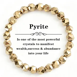 Natural faceted pyrite stone bead bracelet for manifesting wealth and success on white background