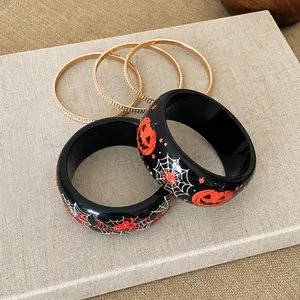 Bracciali di Halloween in resina con motivi di zucca e ragnatela su scatola
