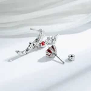 Cool style silver stud earrings featuring vibrant red zircon and delicate star cross charms