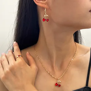 Sweet vintage jewelry set with red heart cherry necklace, earrings and ring on model