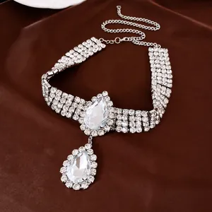Luxury silver-toned rhinestone choker necklace with large pear-shaped teardrop pendant.