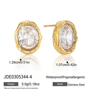 Detailed view of oval CZ stud earrings with dimensions, 18k gold plating, and features.