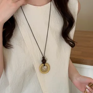 Vintage long pendant necklace with double wooden rings for women in old money style
