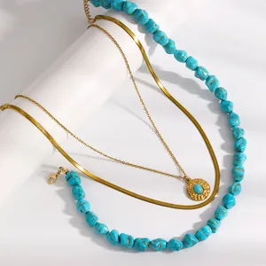 Detailed view of luxury layered turquoise beaded necklace with elegant golden snake chain