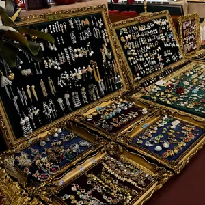A collection of vintage palace style jewelry sets with floral rhinestone and heart motifs