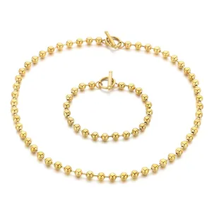 Ensemble collier et bracelet en acier inoxydable doré avec chaîne à billes et fermoir à bascule OT