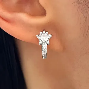 Sparkling silver star-shaped ear cuff featuring micro-paved crystals close-up detail view