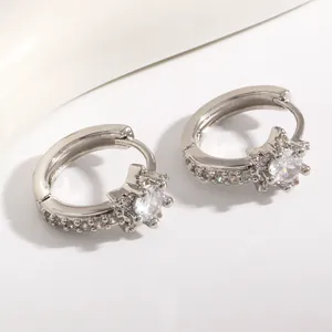 Close-up of elegant sterling silver star hoop earrings featuring micro-set cubic zirconia