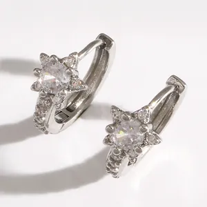 Close-up of elegant silver star hoop earrings with micro-pave sparkling crystals